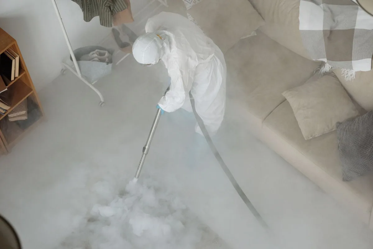 Biohazard cleanup technician in protective equipment, Weyauwega, WI